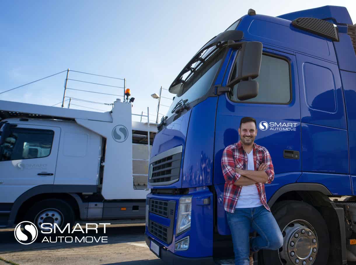 A car transporter leans on a car hauler