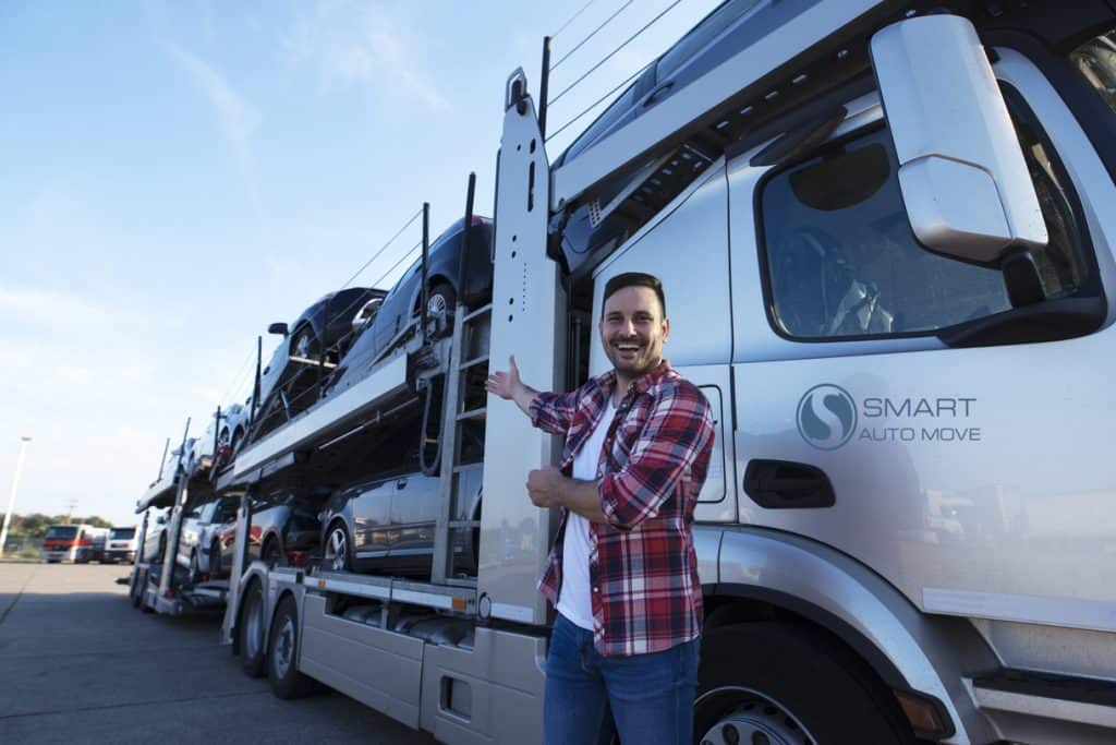 A Car Shipper shows off his vehicle shipping truck