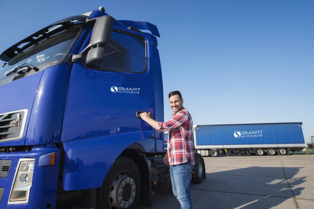 Car shipping truck driver with truck