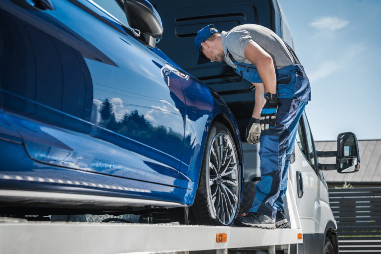 Car Transporter Securing Vehicle on Smart Auto Move Truck