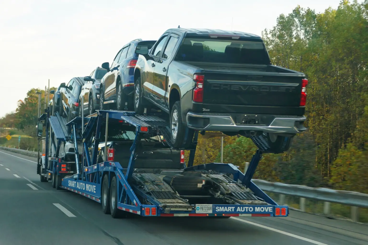 Best auto transport companies comparison with a multi-car carrier transporting vehicles