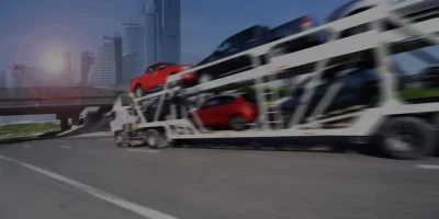 Vehicle shipping truck in traffic